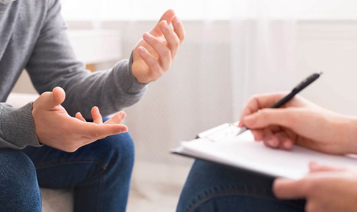 Two people talking at a Gulf Coast drug rehab